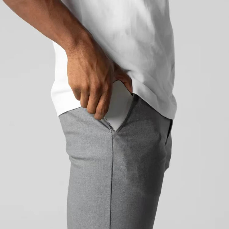 Spodnie z tapered slim, z kieszeniami, z guzikiem i wykończeniem na końcach