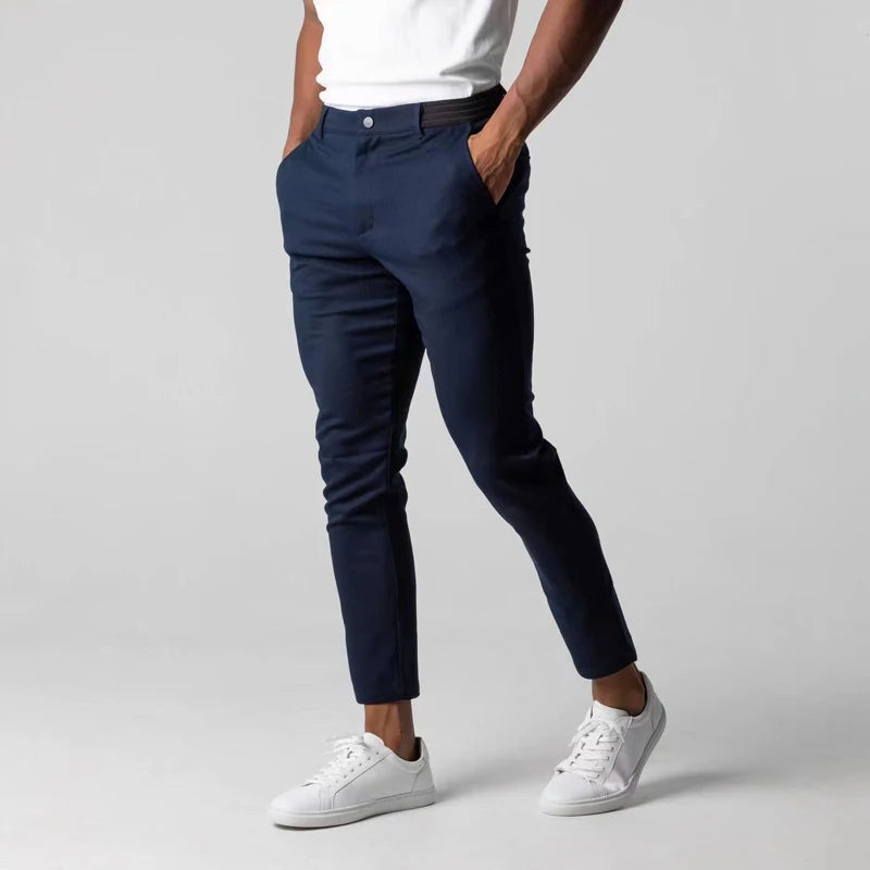 Spodnie z tapered slim, z kieszeniami, z guzikiem i wykończeniem na końcach
