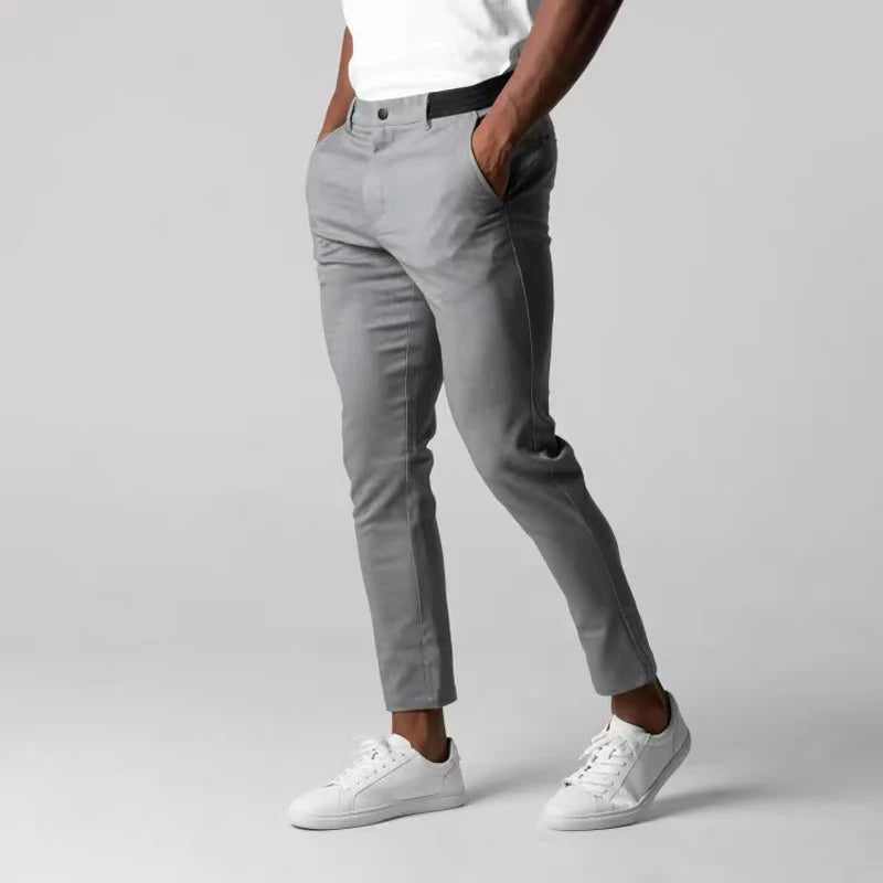 Spodnie z tapered slim, z kieszeniami, z guzikiem i wykończeniem na końcach